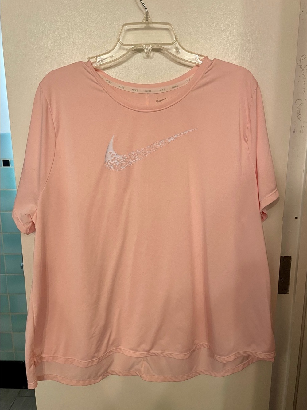 Nike Women's Light Pink Short Sleeve Dri-Fit Tee with White Swoosh